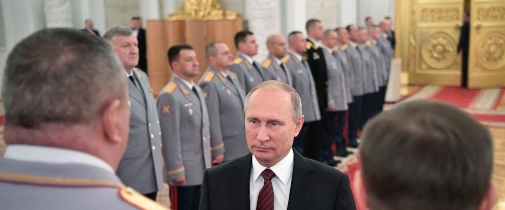 Putin takes part in Russian military drills, fires missiles