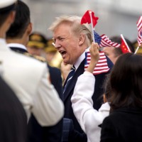 Trump visits Beijing amid mounting tensions over trade