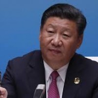 China vows to clean up pollution, further open economy