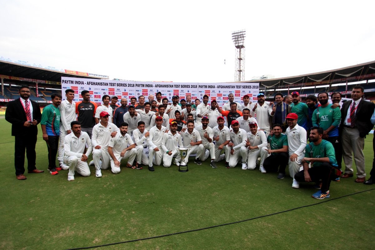 Rahane wins hearts by asking Afghani players to pose with the match trophy Rahane wins hearts by asking Afghani players to pose with the match trophy