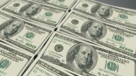 Dollar ticks up on rising risk aversion