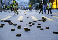 Black-clad men hurl petrol bombs at HK police station Black-clad men hurl petrol bombs at HK police station