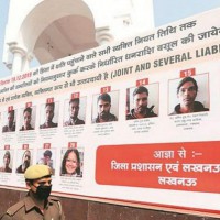 Yogi govt not to take down hoardings, to challenge HC order