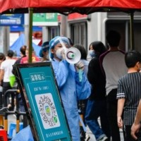 As Shanghai struggles with Covid, cases spike in Beijing