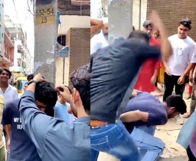 Thief beaten up, head shaved off by mob in Delhi Thief beaten up, head shaved off by mob in Delhi