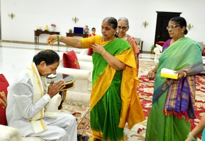 Sisters tie rakhis to Telangana CM Sisters tie rakhis to Telangana CM