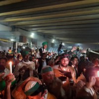 Protesting farmers hold candle march for Pulwama martyrs