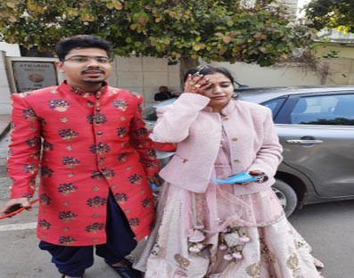 Straight from wedding hall, just married couple casts vote