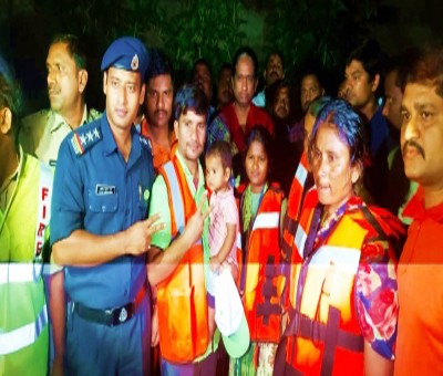 NDRF rescues family stuck in flood waters in Hyderabad NDRF rescues family stuck in flood waters in Hyderabad