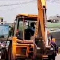 Flag march of bulldozers ahead of 3rd phase of panchayat polls in MP's Morena