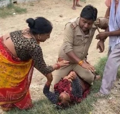 Police official accused of sitting on top of woman, hitting her Police official accused of sitting on top of woman, hitting her