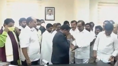 Collector draws ire for touching Telangana CM's feet