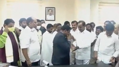 Collector draws ire for touching Telangana CM's feet Collector draws ire for touching Telangana CM's feet