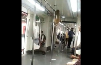 Video showing monkey travelling in Delhi Metro goes viral Video showing monkey travelling in Delhi Metro goes viral