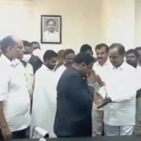 Collector draws ire for touching Telangana CM's feet