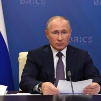 Putin urges global unity in combating Covid