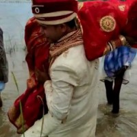 Bihar groom carries bride on shoulder across river