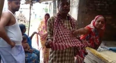 Bihar couple begs for money to get son's body released from govt mortuary Bihar couple begs for money to get son's body released from govt mortuary