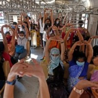 Yoga in train: Mumbai local commuters perform asanas while travelling