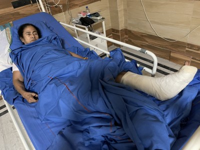Mamata in hospital with plaster cast on her leg