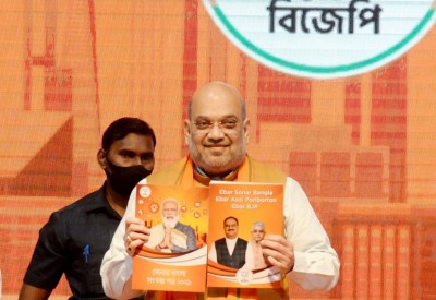 Shah releases BJP's Bengal manifesto with focus on border safety Shah releases BJP's Bengal manifesto with focus on border safety