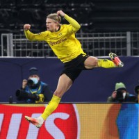 Haaland brace takes Dortmund to Champions League quarters
