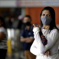 Brazil reports 1,555 new Covid deaths