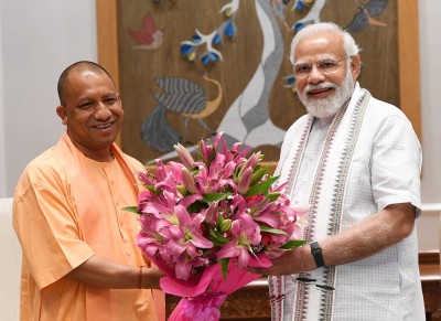 Yogi meets PM Modi, discusses new UP cabinet Yogi meets PM Modi, discusses new UP cabinet