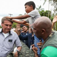 Thousands rally against Bolsonaro's Covid policies