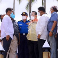 SL PM inspects coastal area affected by burning ship