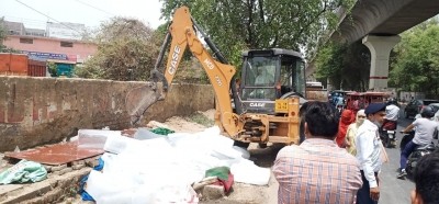 Bulldozer rolls near Delhi's Rithala metro station Bulldozer rolls near Delhi's Rithala metro station