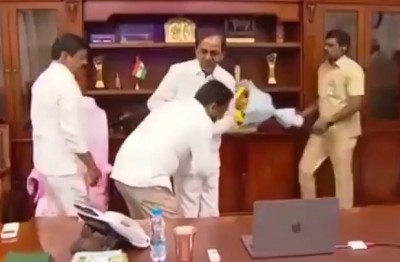 Telangana official triggers row by touching CM's feet