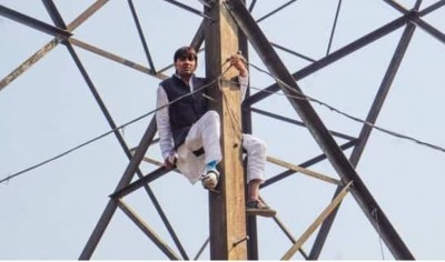 Denied ticket for MCD polls, ex-AAP councillor climbs atop transmission tower Denied ticket for MCD polls, ex-AAP councillor climbs atop transmission tower