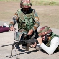 Vijay Deverakonda shoots with a rifle along with a jawan