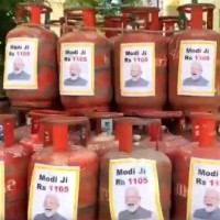 TRS hits back at FM with PM's pictures on LPG cylinders