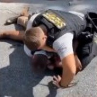 US cop fired for 'pinning, punching' black man