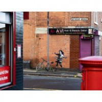 Celebrated graffiti artist Banksy confirms UK hula-hooping girl mural is his work