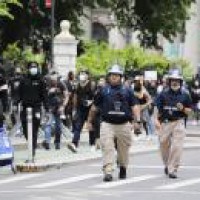 2 NY officers charged with felony assault for shoving protester