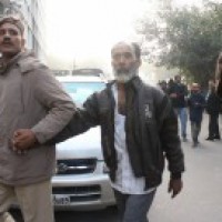 Families of arrested persons wait anxiously outside court