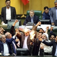 Iranian lawmakers burn US flag, yell ‘death to America’ after Trump withdraws from nuclear deal 