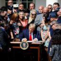 Trump signs $100bn relief package amid dire economic signals