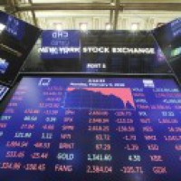 Wall Street tumbles after US tops world in COVID-19 cases