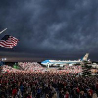Trump wears 'MAGA' cap, pulls off tie at Iowa rally