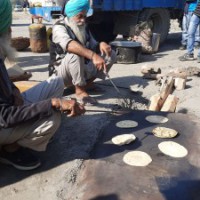 Good Samaritans offer 'langar' to people at Delhi's Burari ground